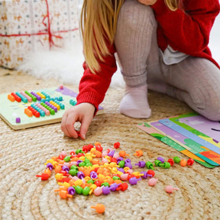 Peg mosaic with a wooden base and pattern cards