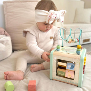 Motor activity play cube in pastel shades