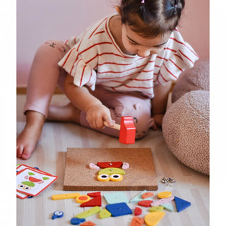 Tap tap  hammering game with a cork base and picture cards