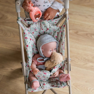 Foldable doll stroller with floral pattern