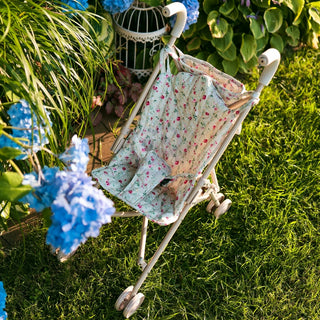 Foldable doll stroller with floral pattern