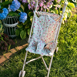 Foldable doll stroller with floral pattern