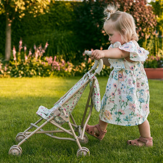Foldable doll stroller with floral pattern