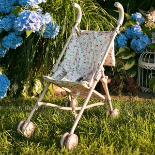 Foldable doll stroller with floral pattern