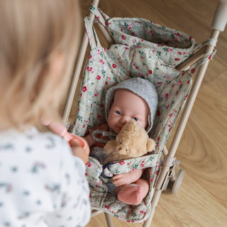 Foldable doll stroller with floral pattern