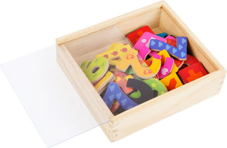 Colorful magnetic numbers in a wooden box