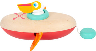 Wind-up water wooden toy Pelican in a canoe