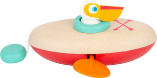 Wind-up water wooden toy Pelican in a canoe