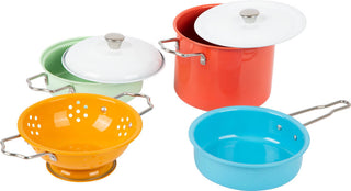 The colorful set of play pots and kitchen utensils