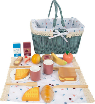 Toy wooden picnic set in a wicker basket Tasty