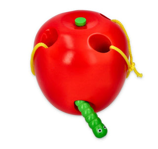 Threading toy apple with a worm