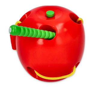 Threading toy apple with a worm